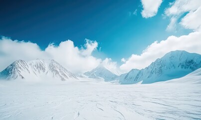 Obraz premium Serene Winter Mountain Landscape Under a Vibrant Blue Sky