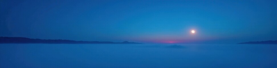 Obraz premium Blue hour sky, thin veil of fog, half moon visible, clouds, half moon