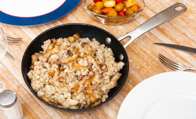 Delicious serving of barley porridge with lard served beautifully