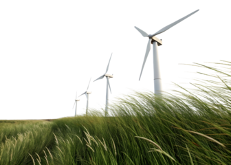 Wind turbines spin gently over tall grass fields in an open landscape on a clear day with bright skies