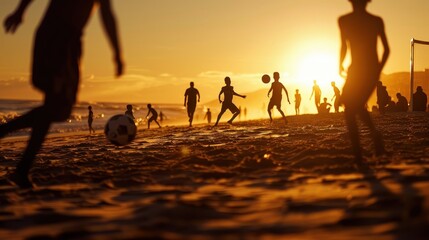 Football match at sunset on a beach with silhouetted players