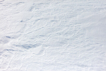 The snow is white and the ground is covered in it