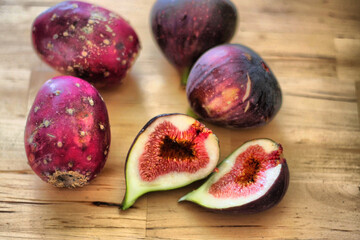 "Fresh Figs and Prickly Pears on Wooden Surface