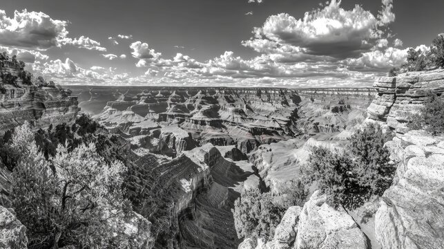 Majestic Black and White Landscape of Grand Canyon with Dramatic Clouds and Rocky Formations in Arizona