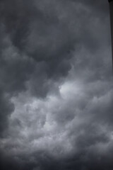 Storm Clouds: An imposing skyscape of ominous storm clouds swirling and gathering, evoking a sense of impending weather changes and the raw power of nature. 