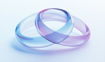 Two translucent glass rings, blue and pink, overlapping on white background.