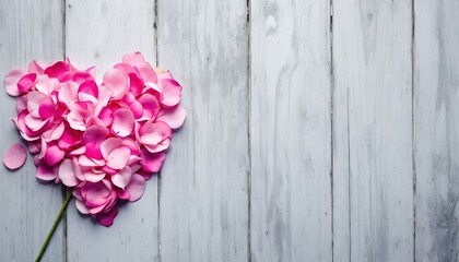 Pink flowers arranged in heart shape, Gray wooden background