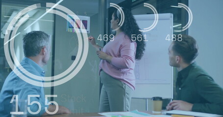 Image of data processing over diverse business people at meeting