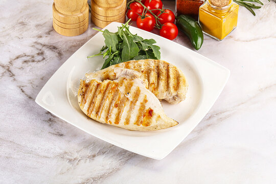 Grilled chicken breast served arugula