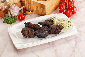 Grilled beef barbecue served onion