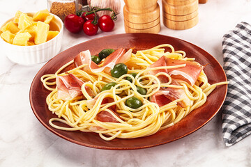 Pasta spaghetti with olives and jamon