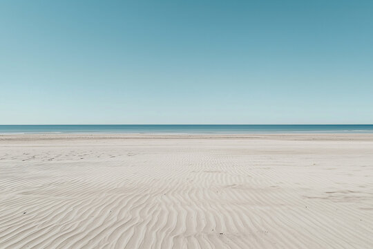 wide camera angle captures deserted sand beach under clear blue sky - Powered by Adobe