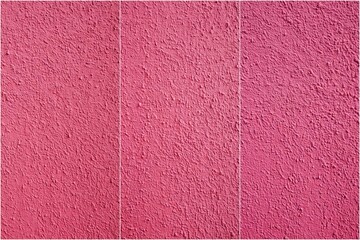 Fototapeta premium A pink wall with a pattern of three stripes. The wall is made of a material that looks like a carpet