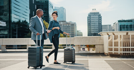 Professional, walking and business people with suitcase in city for travel, work trip and commute...