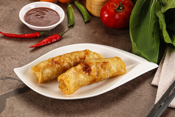 Vietnamese stuffed spring roll served sauce