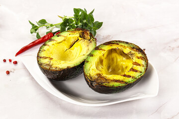 Sliced fresh avocado on the grill