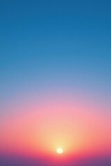 A clear sky displays a gradient of blues and pinks as the sun dips below the horizon, blue, sunset