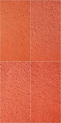 Fototapeta premium A close up of a red wall with a patterned texture. The wall is made of a material that is orange in color