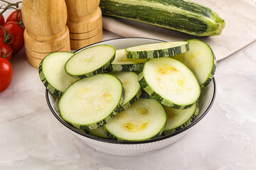 Raw green zucchini slices for cooking