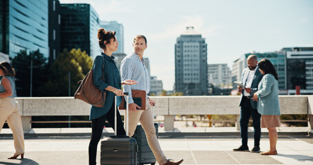 City, walking and business people with suitcase talking for travel, work trip and commute to...