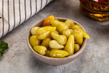 Turkish traditional marinated mini chili peppers
