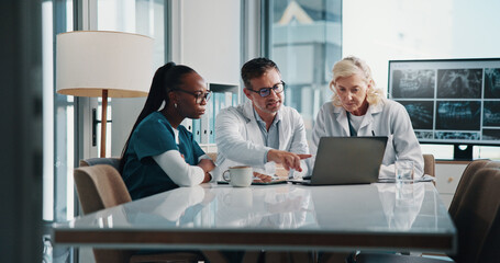 Hospital, teamwork and doctors on laptop in meeting for consulting, discussion and medical advice....