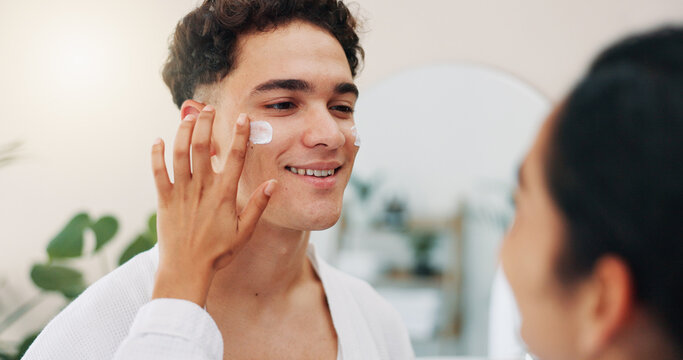 Home, couple and happy with cream for skincare, wellness and hydration benefits in morning. House, man and woman with application for cosmetics, beauty treatment and support with moisturizer for face - Powered by Adobe