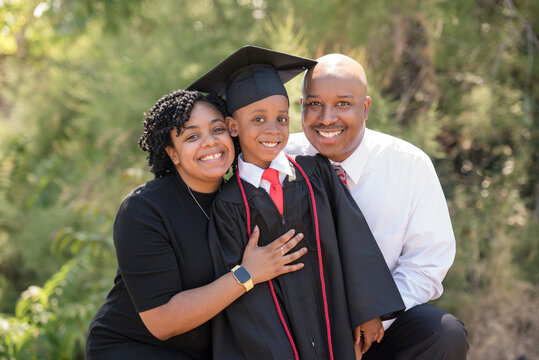 Proud parents celebrate their child's graduation milestone