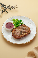 steak with lingonberry sauce and herbs