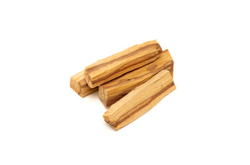 Palo Santo wooden sticks isolated on clean white background, showcasing their natural texture and earthy tones.