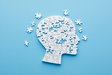 Fragmented mind puzzle head on light blue background