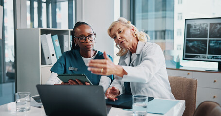Explanation, doctor and medical student in hospital with laptop for surgery planning in collaboration. Women, conversation and mature surgeon with healthcare intern for teaching treatment with xray.