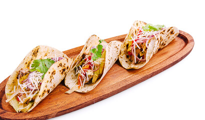 Delicious tacos served on a wooden platter with fresh ingredients