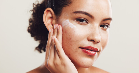 Portrait, cream and woman with dermatology, cosmetics and shine on white studio background. Face,...