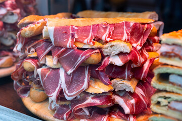 Showcase with sandwiches with jamon, popular tapas of Spanish province of Salamanca