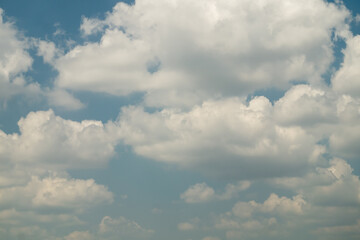 Many fluffy clouds on blue sky