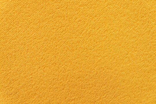 Ribbed orange surface of a camping mat as texture, background