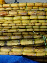 sugarcane stacked, neatly arrange in row