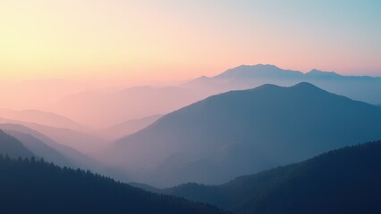 Layers of misty mountains at sunrise with a gradient sky transitioning from pink to blue.