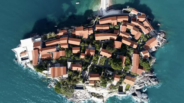 Drone flight aerial view of Sveti Stefan island - hotel. Montenegro, Europe