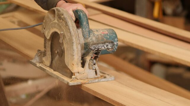 Circular Saw Cutting Plank, Lumber handheld shot