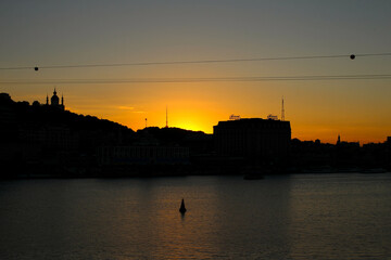 Fototapeta premium Silhouette, summer, sunset, shadow, river, lake, sky, city, houses, urban