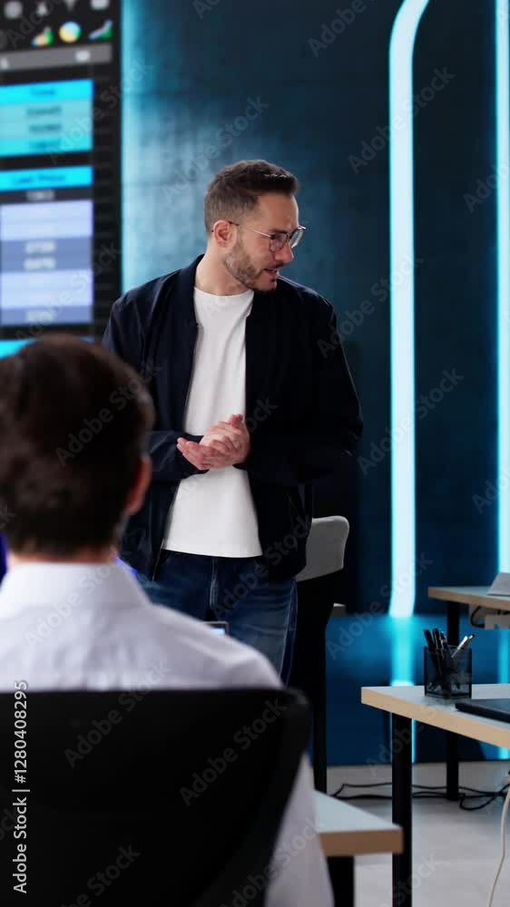 Poster executive giving spreadsheet training presentation with data