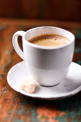 Cup of coffee on wooden background. Soft focus. Copy space
