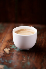 Cup of coffee on wooden background. Soft focus. Copy space