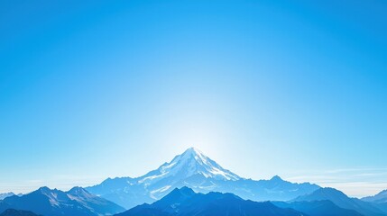Mountain range with snow capped peak under blue sky with clouds in a scenic landscape during daylight hours