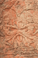 A bas relief, bas-relief, stone carving on a wall of the Bayon Temple, two dancing apsaras, Angkor...