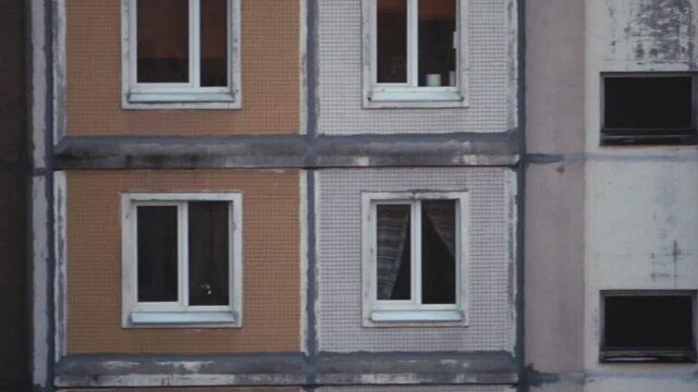 Urban brutal post-Soviet panel house with window. 90s residential area in Minsk, Belarus