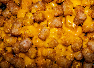 Close-up of cheesy potato puffs tater tots