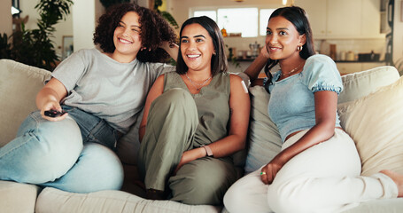 Woman, friends and smile watching tv, movies and bonding in living room with remote. People,...